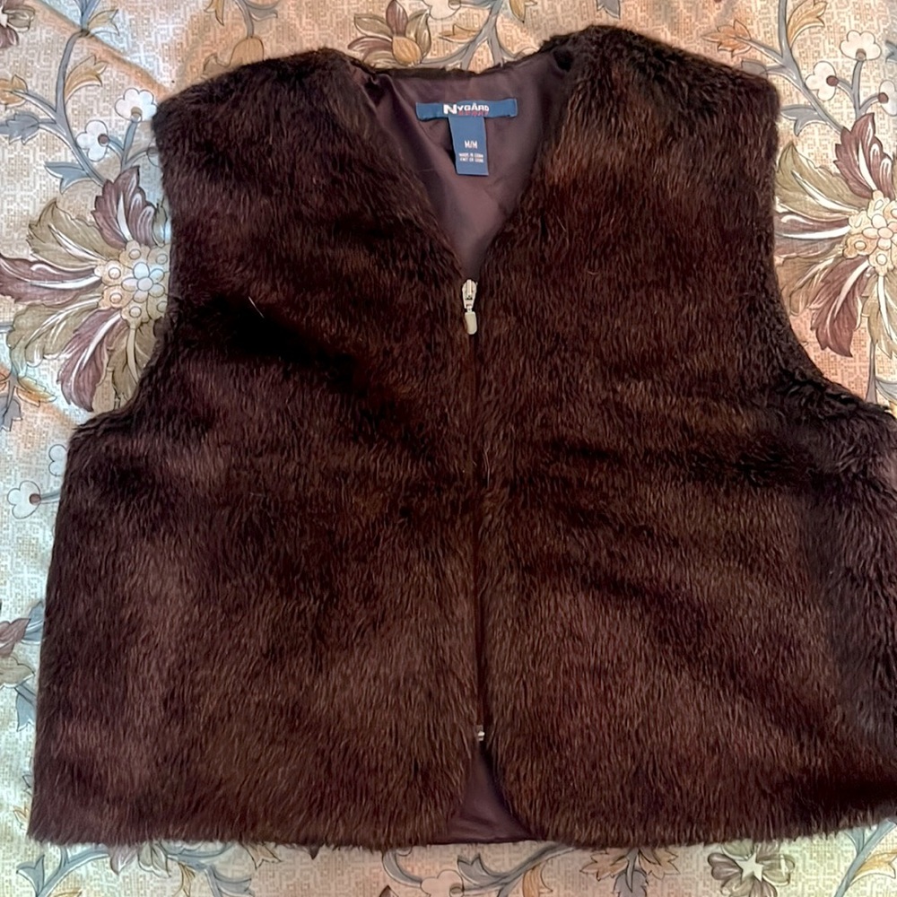 Cute as hell purple furry vest. Great with a turtle neck!